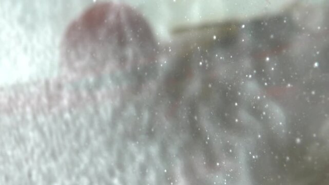 Washing the windshield of the bus. Soaping and hosing