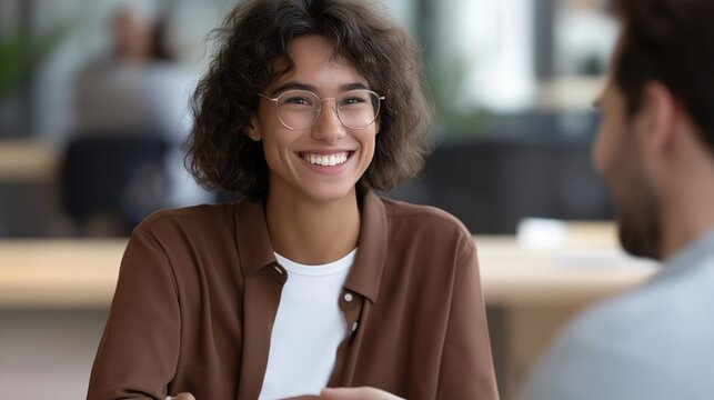Young CEO signs employee equity documents with first hires in modest office, significant moment of trust and commitment evident in expressions, ideal for startup team building, employee ownership,