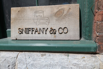 Naklejka premium old sign at Sniffany & Co Pet Boutique & Spa, a pet store, located at 10 Case Goods Lane, Distillery District, Toronto