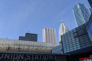 Naklejka premium Union Station sign Maple Leaf Square / Jurassic Park entrance, off Bremner Blvd, Toronto (with financial district towers)