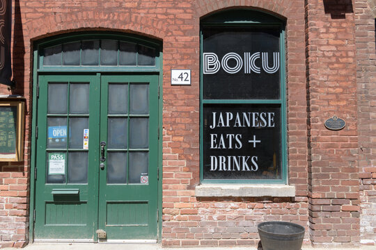 exterior of Boku, Japanese Eats + Drinks at 42 Gristmill Lane located within a historic Distillery District building, Toronto