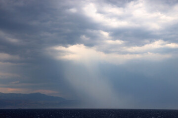 Obraz premium Clouds and storm over the sea. 