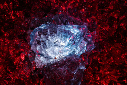 Abstract glowing ice crystals with red and blue illumination in dark environment