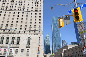 Naklejka premium looking east from intersection of University Av, York St, and Front St W to (left) Fairmont Royal York hotel and office buildings, Toronto