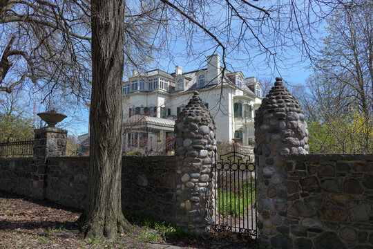 beyond the gate view of Spadina House, a historic house museum, for Baldwin, Austin family, built 1866 with later additions, 285 Spadina Rd, Toronto