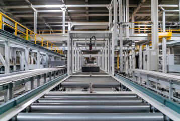 Naklejka premium Efficient Automated Production Line in Modern Manufacturing Facility with Advanced Conveyor Systems for Streamlined Industrial Operations