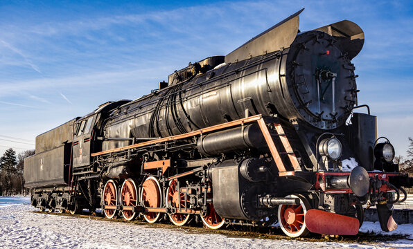 Historic Ty51 steam locomotive in winter snow Poznan Poland