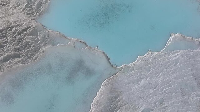  An aerial view of the Pamukkale Travertines. Pamukkale Travertines Drone Video, Pamukkale Denizli, Turkiye (Turkey)