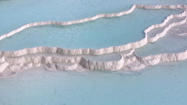  An aerial view of the Pamukkale Travertines. Pamukkale Travertines Drone Video, Pamukkale Denizli, Turkiye (Turkey)