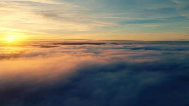 Golden sunset light illuminating a thick layer of clouds