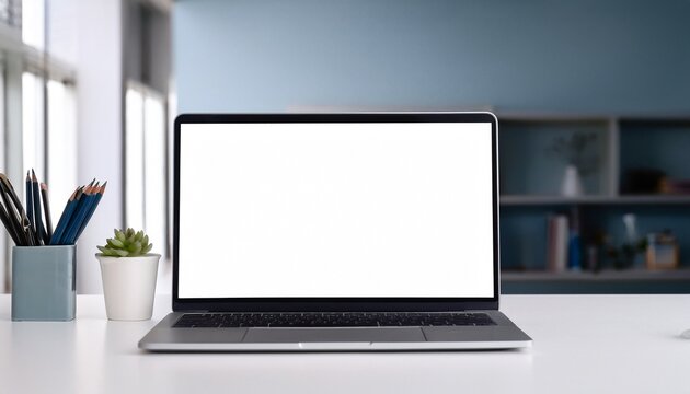 blank white screen mockup of a modern laptop on a white table in a minimalist office facing forward
