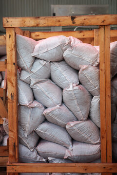 Warehouse of finished agricultural products. Finished products are packaged in bags and stacked in wooden box.