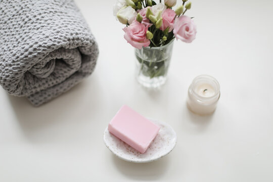 top view of natural decorated homemade soap with flowers on white surface. spa organic soap. Natural vegan soap with rose fragrance