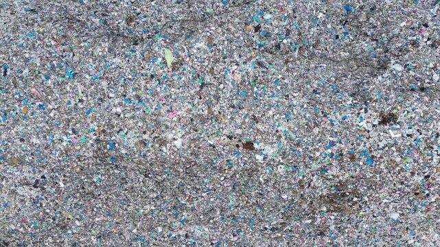 Abstract plastic waste texture forming detailed garbage pattern background aerial
