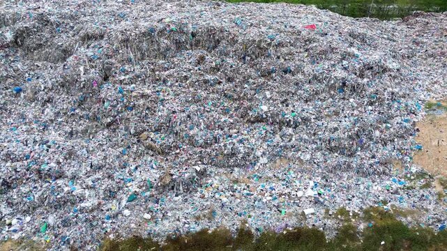 Abstract plastic waste texture forming detailed garbage pattern background aerial
