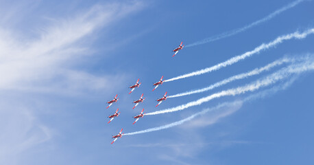Vintage Propeller Aircraft Flying in Blue Sky © Michael