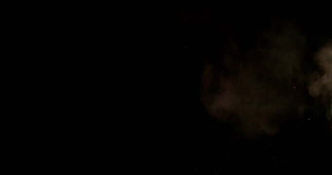 Super slow motion sandstorm and dust blizzard effect with airborne sand and fine particles, filmed at 500 fps on a high-speed camera. Isolated on black background, ideal as realistic VFX overlay.