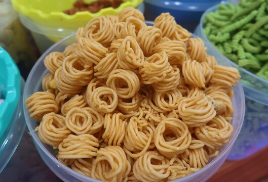 Thread onion murukku is a Indian homemade snack for tea time made from lentils and rice deep fried in coconut oil