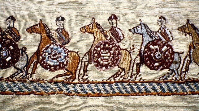cavalry. Close-up of an ancient tapestry section depicting medieval cavalry and shield walls. event programs, museum guides, designed for cultural heritage projects and event programs.
