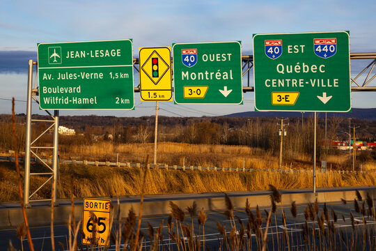 
Several green traffic signs over highway indicating the Jean-Lesage International Airport, as well as different streets and highway 40 towards Montreal and towards Quebec City, Quebec City, Quebec, C