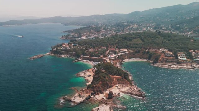 Aerial Panorama of Kanoni Coastal Villages and Rugged Mountain Range in Corfu Greece