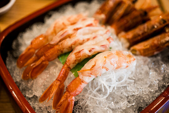 Fresh and raw of shrimp sashimi served on ice. Selective focus.