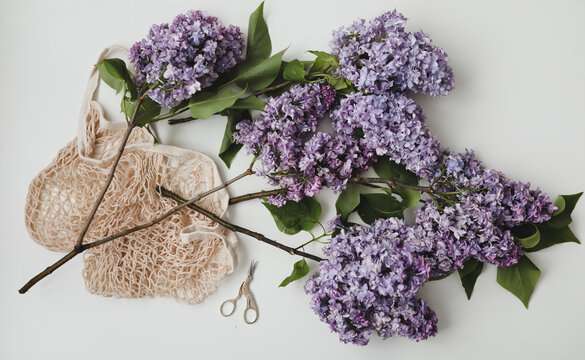 Home interior decor, bouquet of lilacs on table top view