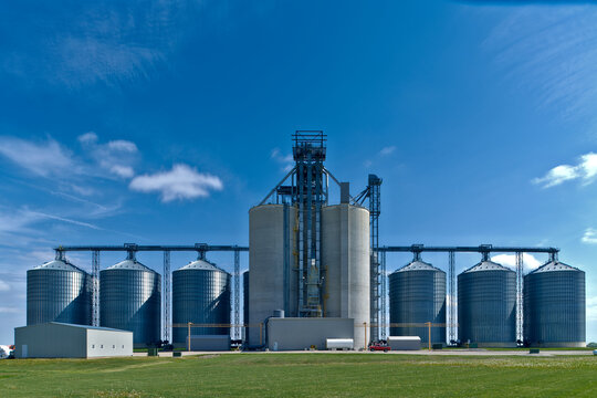 Visible from the distant horizon, the symmetry of the silver silos stand as sentinels over the agricultural heartland.
