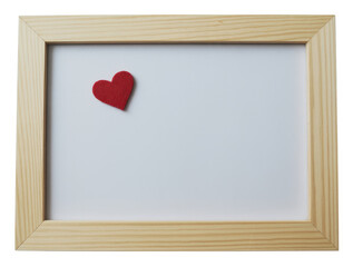 Fototapeta premium Small red felt heart shape placed inside a simple light colored wooden frame border