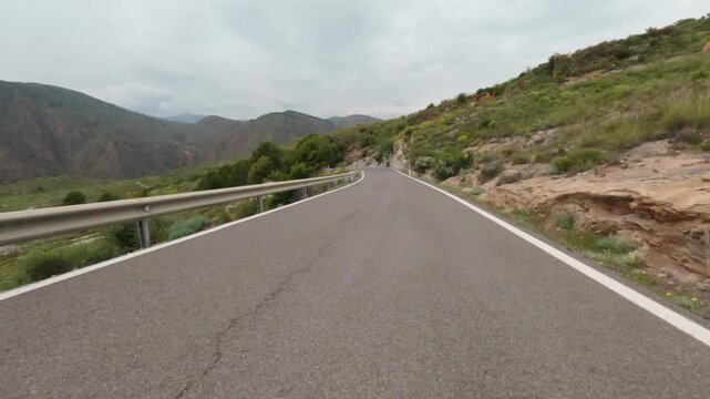 Driving on a mountain road in Spaion. POV on-board camera. 4K Video footage, 50p, 10 bit