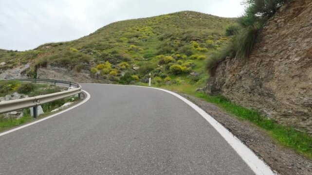 Driving on a mountain road in Spaion. POV on-board camera. 4K Video footage, 50p, 10 bit