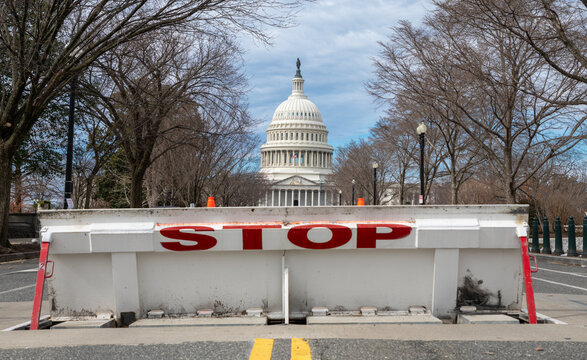 Stop barricade blocking Capitol entrance. Government shutdown issue in Washington DC. Security control near Capitol Hill building. National political conflict in United States.