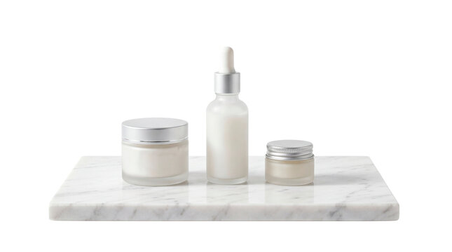 Three white cosmetic products, a dropper bottle and two jars, sit on a white marble slab