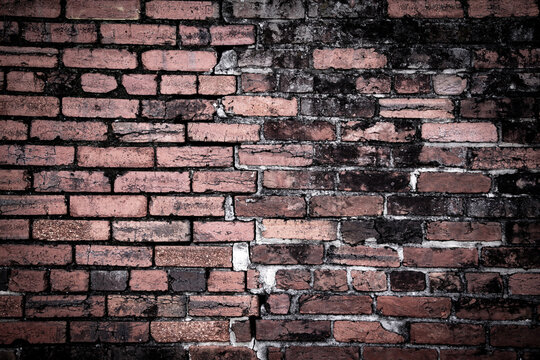 Broken bricks brickwall texture background. Broken bricks wall pattern surface. Broken bricks masonry structure texture. Broken bricks rustic damaged wall.