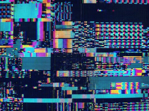 Abstract digital glitch art with vibrant neon colors and pixelated distortions creating a chaotic visual texture.