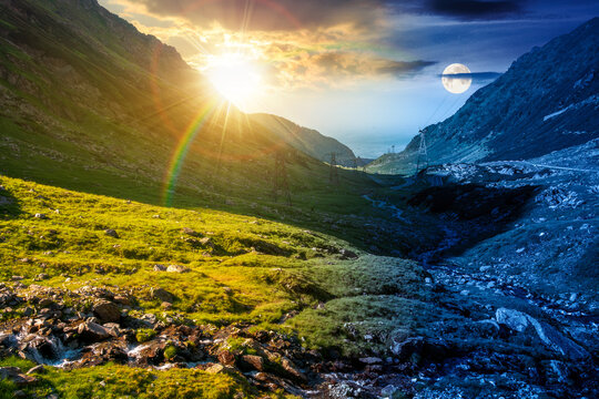 day meet night. road through mountains winding uphill. sun and moon over popular highway travel destination. epic view of mountain on summer solstice weather. road journey landscape wallpaper