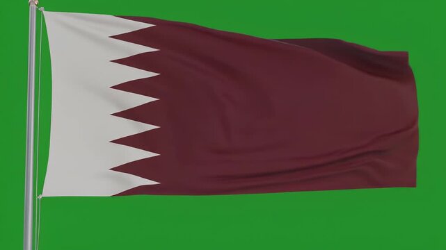 The flag of Qatar waves on a pole against green screen background