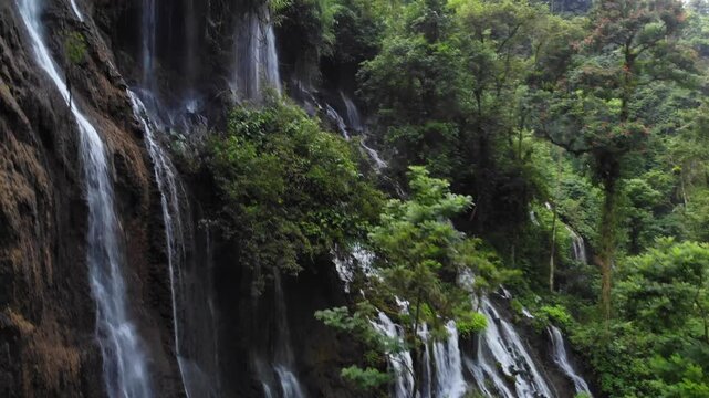 Drone Ascending from Low to High Over Jungle Waterfalls in Tumpak Sewu Complex, Java, Indonesia