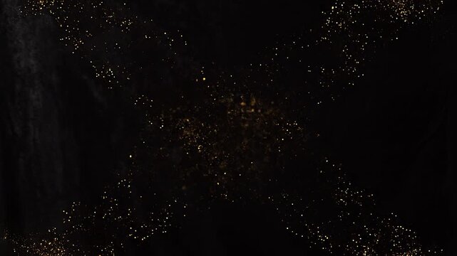 Golden glitter particles forming horizontal glowing line on black background representing luxury energy motion sparkle and abstract light beam concept