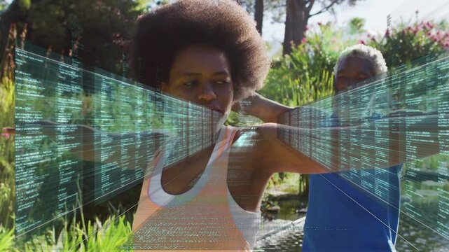 Coach guiding woman stretching in garden, AR overlay appearing, tracking limb movement for fitness