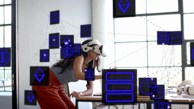 Designer in VR headset reaching into air making floating blue panels appear and iterating models