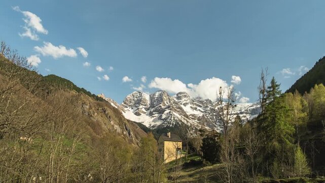 Time-lapse of clouds passing the snow covered Cirque de Gavarnie in the French Pyrenees as dusk falls into night