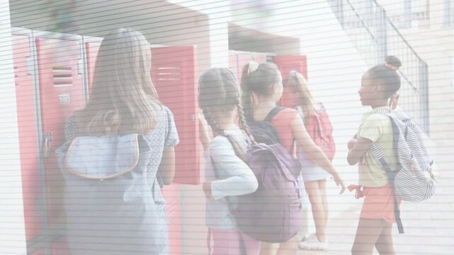 Locker line advancing, five schoolgirls opening red lockers, stowing backpacks between classes