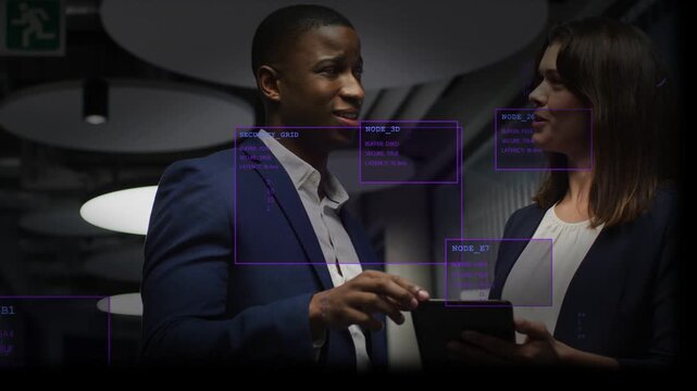 Man tapping tablet, woman steadying tablet, HUD boxes shifting and tracking security for business