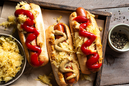 Bratwurst with sauerkraut in roll bun