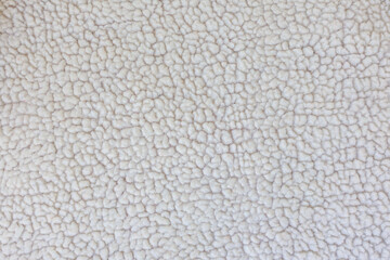 Macro texture of faux shearling fabric dense fluffy textile background winter material © Iryna Miadzvedzeva