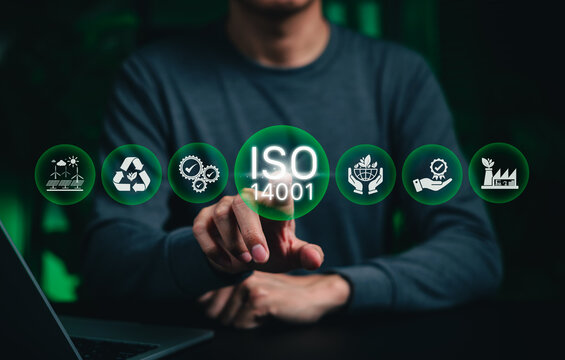 ISO 14001 environmental compliance and sustainability management concept. Person touching icons for recycling, certification, eco operations, representing EMS standards, responsible business practice
