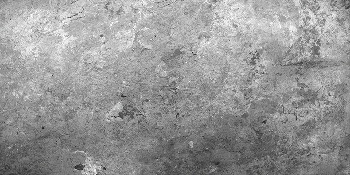 A vintage black and white grunge wall texture with a rough concrete surface and a dirty grainy pattern on a grey stone material backdrop