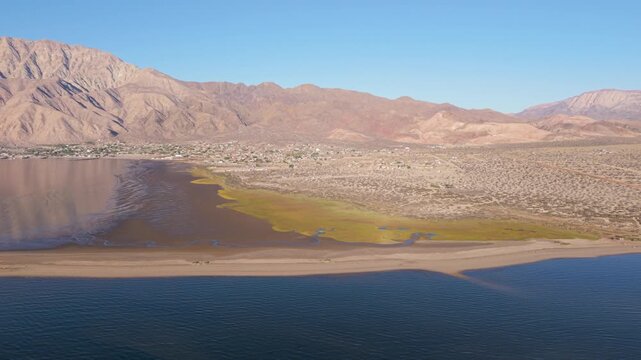 Witness the stunning sunrise over Bahia De Los Angeles with changing colors and light as day breaks over Baja California.