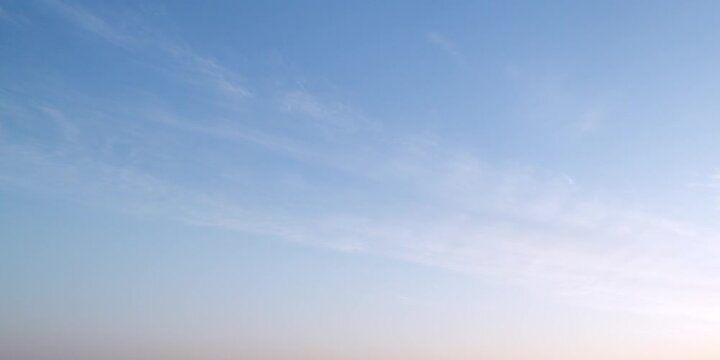 Cloudscape, Timelapse of Soft Cirrus Clouds in a Blue Sky During Sunrise for Background and Backdrop
